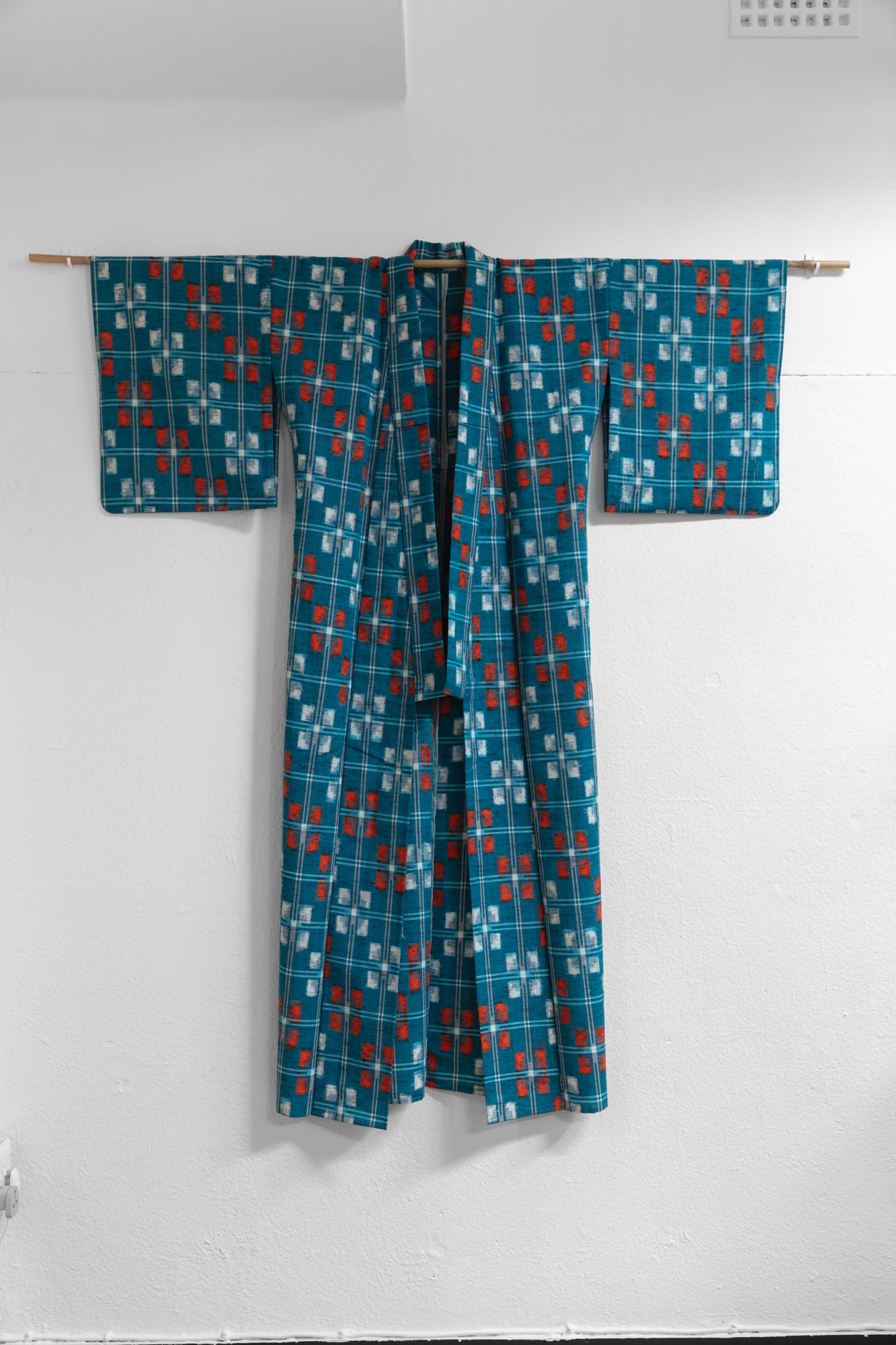 Turquoise base orange kasuri kimono